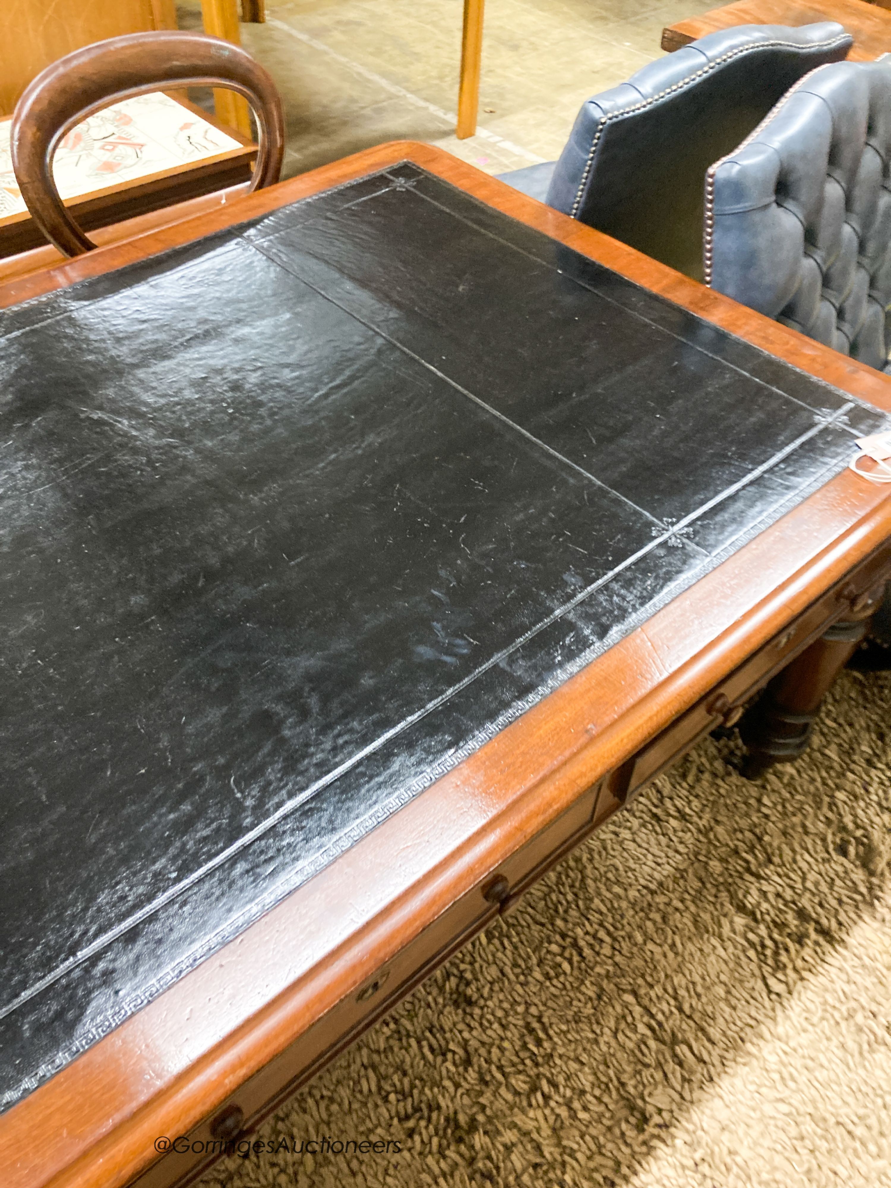 A Victorian mahogany partner's writing table with black leather inset top, length 180cm, depth 102cm, height 72cm